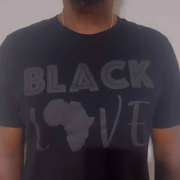 Person wearing a black t-shirt with 'BLACK LOVE' and a map of Africa design.
