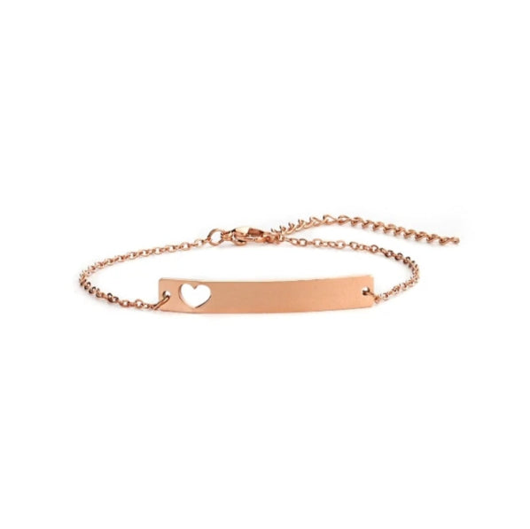 A gold-colored stainless steel bracelet with a hollow heart design on the bar, intended for personal engraving.