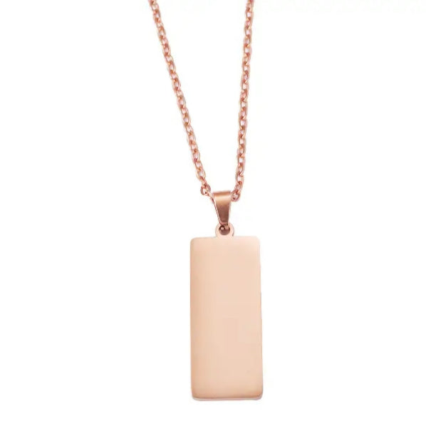 A gold-colored rectangle pendant necklace made of stainless steel, displayed against a white background.
